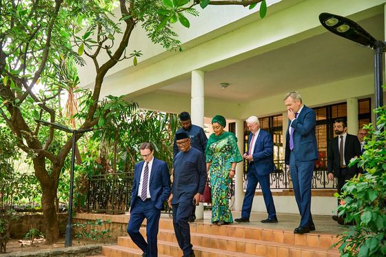 Peter Obi at the top of a flight of steps as a visiting delegation walks down into a garden